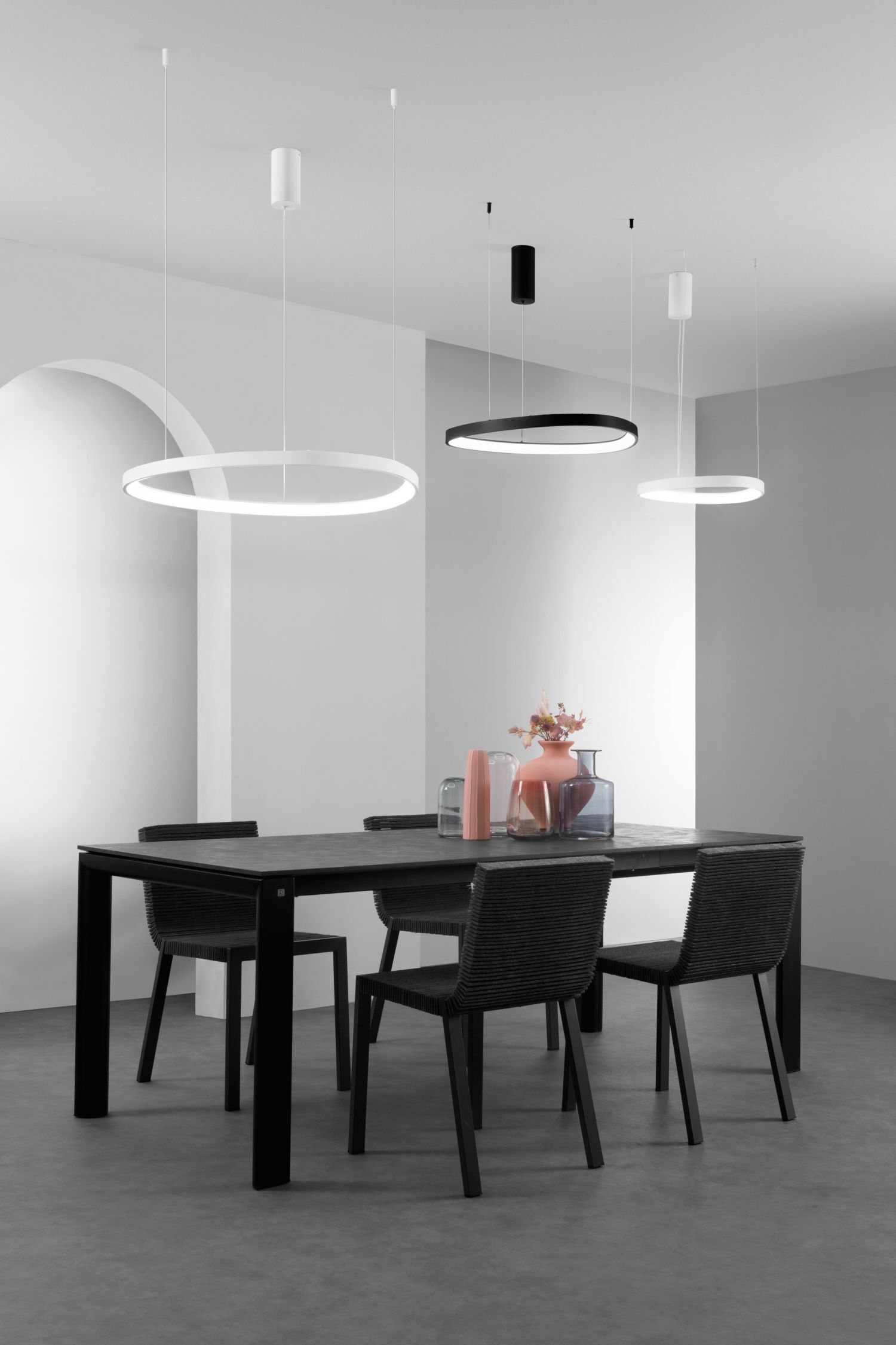 pendant lights, ring lights, dining table, black chairs, decor vases